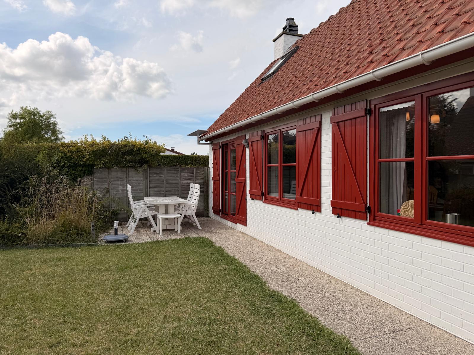 Private enclosed garden with lawn and terrace