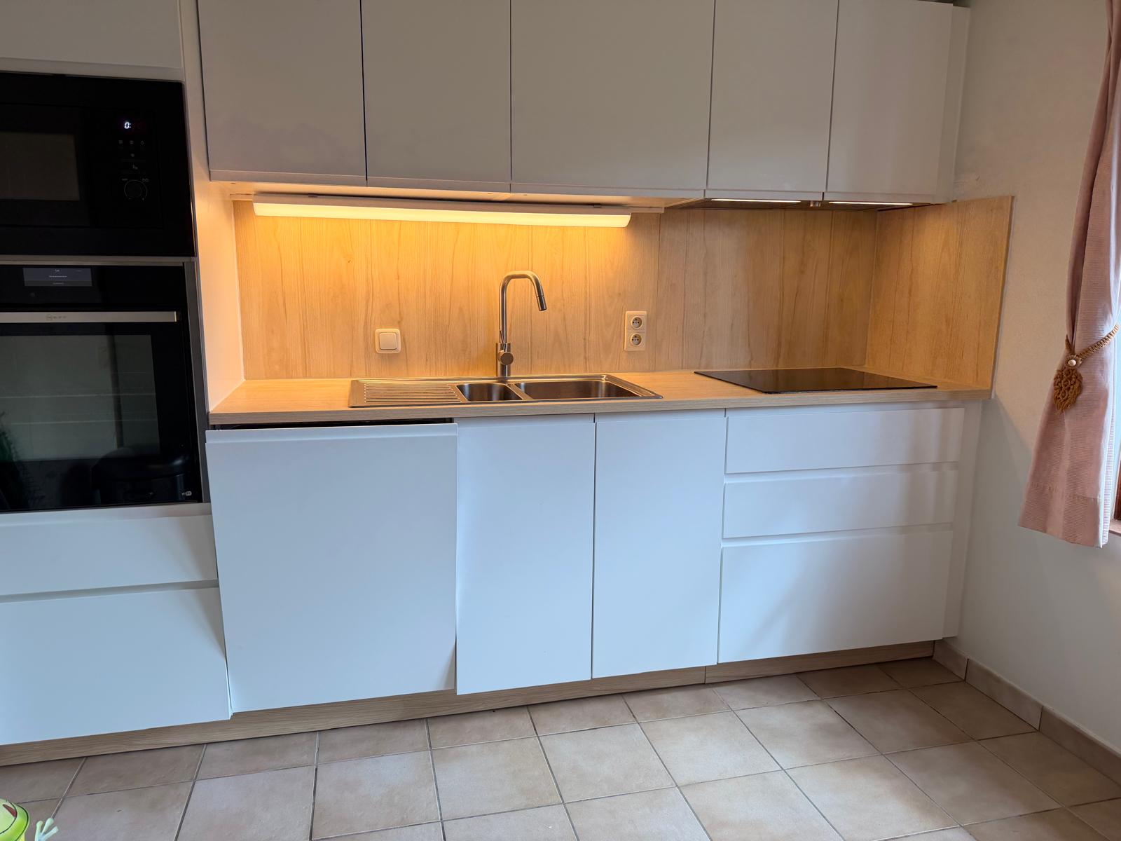 Kitchen with sink, oven and induction hob