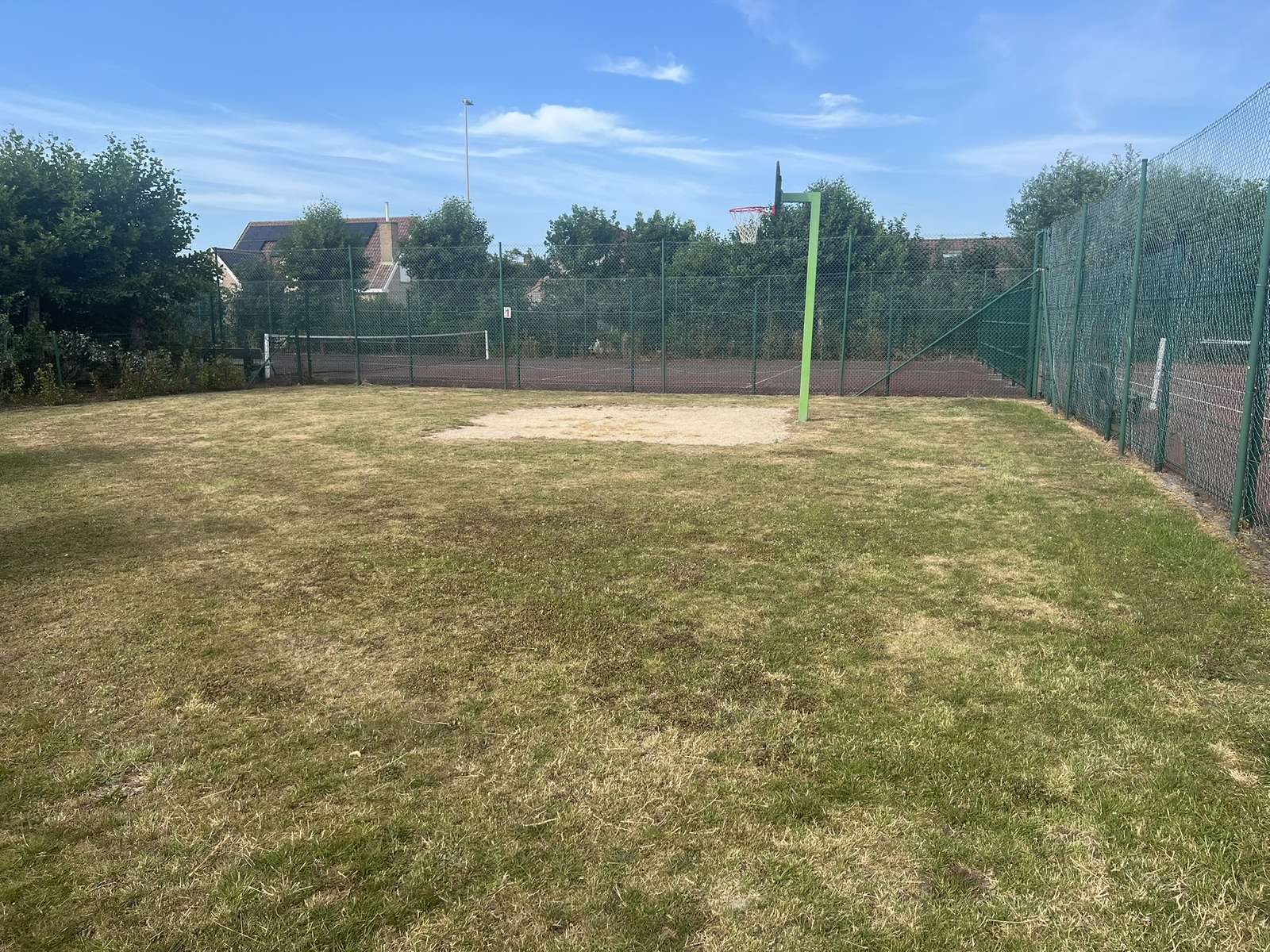 Shared grass sports court at Zeewind II Holiday Park